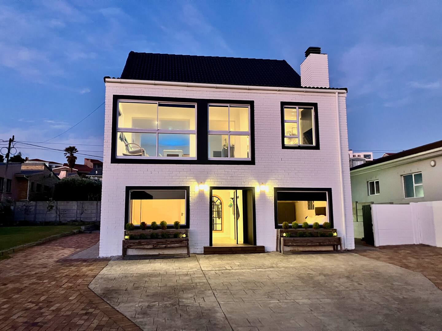 The 7 sails beach house in Yzerfontein lit up at dusk